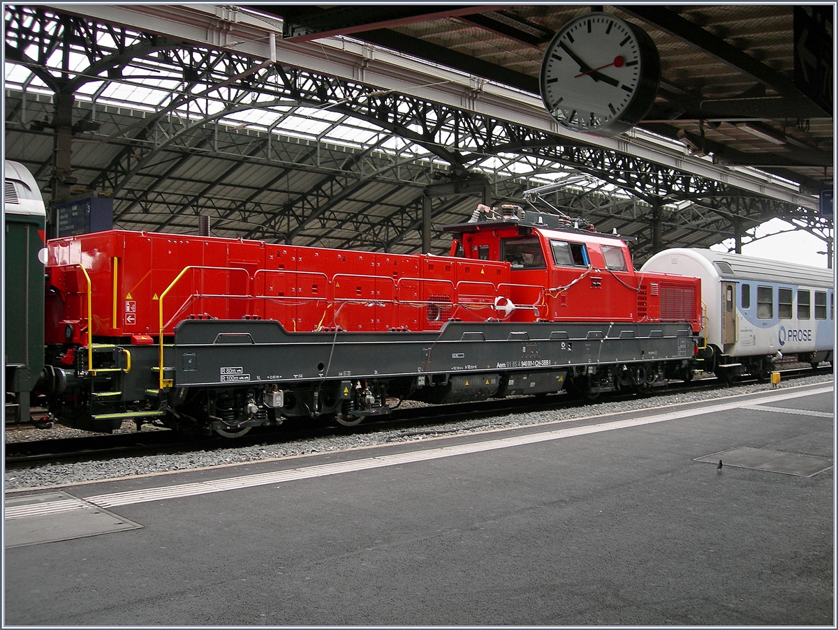 Aem 940 Testfahrten: Da die neue SBB Aem  940 001-1 (UIC 9185 4 940 001-1 CH-SBBI) zwischen den Wagen eingereiht war, konnte sie nur eingeschränkt fotografiert werden.
Lausanne, den 16. Mai 2018